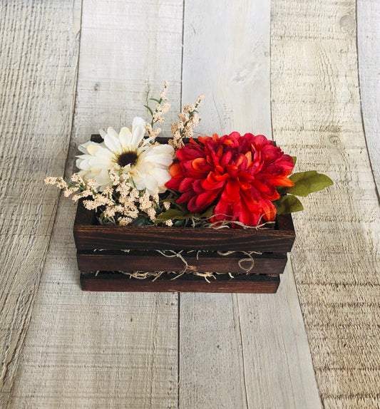 Fall Crate Floral Arrangement Craft Kit available on seniorlycreations.com.  It is a mini crate filled with fall colored flowers.