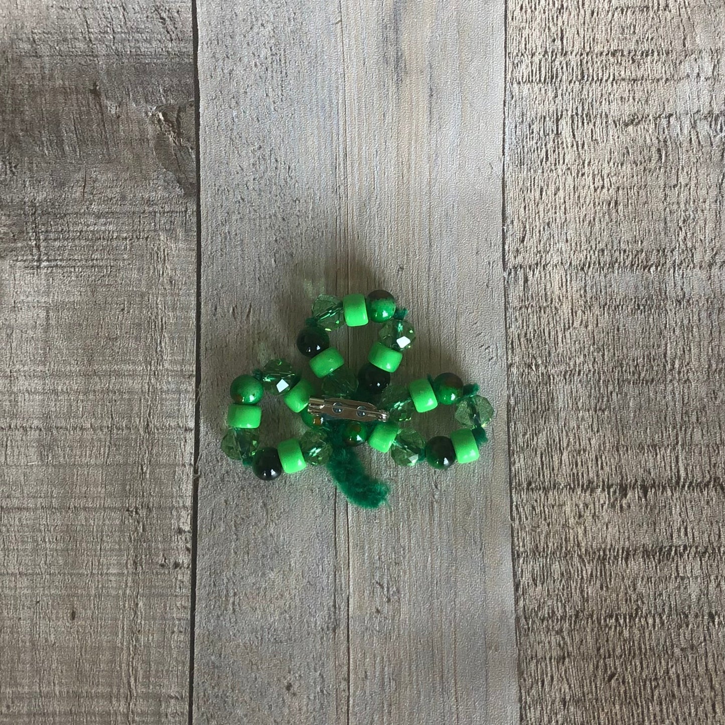 back side of beaded shamrock craft. The craft kit is available on seniorlycreations.com.